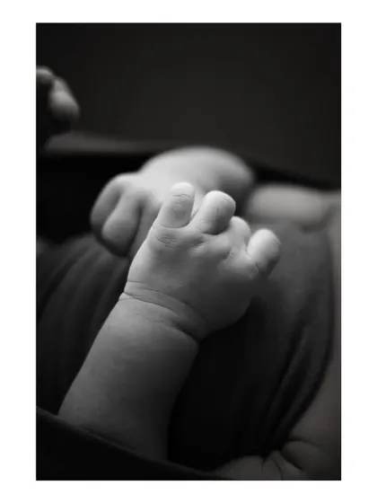 Another detailed black and white shot of a newborn's hand, perfect for remembering their tiny size.