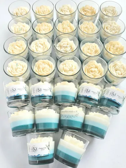 A full view of the 30 ocean-themed votive candles, showing the consistent sea-green and blue layers and white peony toppers.
