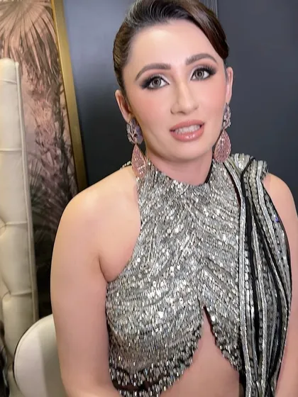 A candid moment showing the soft, radiant finish of the makeup. The skin looks healthy and glowing, and the eyes are defined just enough to make them pop without looking heavy.