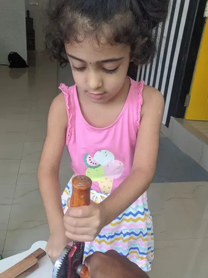 A young girl gets her first lesson in drilling. Our instructors ensure a safe and encouraging environment for every child.