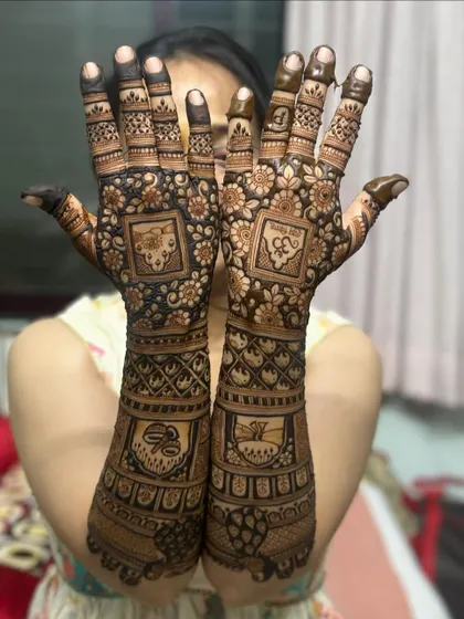 A beautiful design featuring symbolic motifs within square panels, covering the full length of the arms.