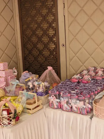 Your event's final touch should be as memorable as the celebration itself. I curated and set up this entire table of baby shower return gifts, making sure every guest left with a beautiful, meaningful thank you.