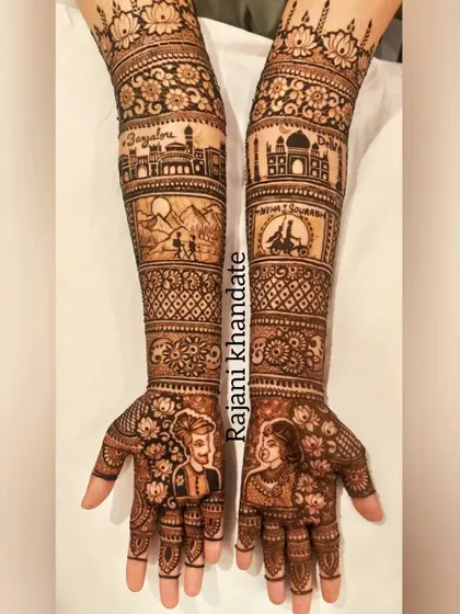 This bespoke bridal design tells a beautiful story, with portraits of the couple on the palms. The arms feature scenes from their journey, including the Bangalore and Delhi skylines, a mountain trek, and a romantic bicycle ride.