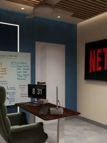 This angle shows the integration of technology and brainstorming tools within the office. A large screen for presentations or entertainment is balanced by a physical whiteboard, catering to different work styles within a single, cohesive space.