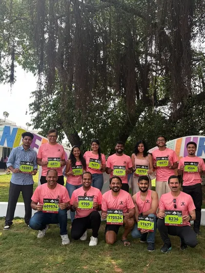 More of our runners at the TCSW10K expo, showcasing their bib numbers. The excitement before a race is a huge part of the experience.