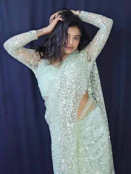 Sonu in a candid, relaxed pose, looking effortlessly chic in our custom creation.