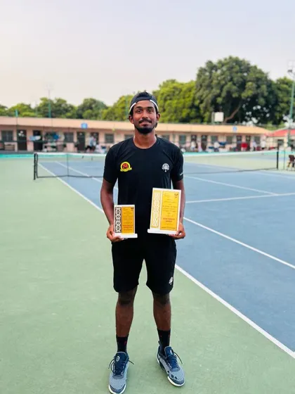 Oges with his singles winner and doubles finalist awards from the AITA 1 Lakh in Jassowal.