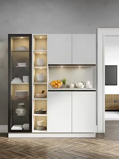 This freestanding crockery unit combines a black-framed glass display case with white cabinets. It's a modern and elegant piece that provides both display and concealed storage.