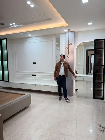 Another angle of the master bedroom, showing the relationship between the bed area and the integrated dressing table.