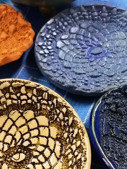 A close look at the rich textures I create using lace and other materials. These small trinket dishes showcase how different glazes interact with impressed patterns, making each one completely unique.