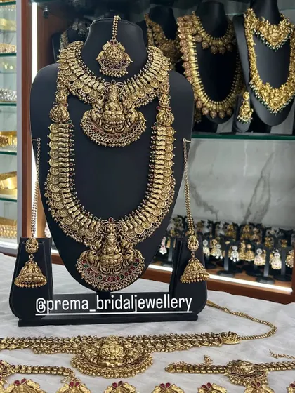 A complete bridal combo including a temple choker, haaram, vaddanam, and other accessories.