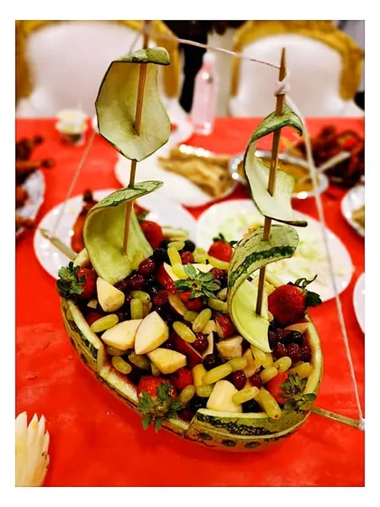 Catering imagination at its finest. Here, I have transformed a watermelon into a beautiful sailboat, complete with cucumber sails and filled with a fresh fruit salad.