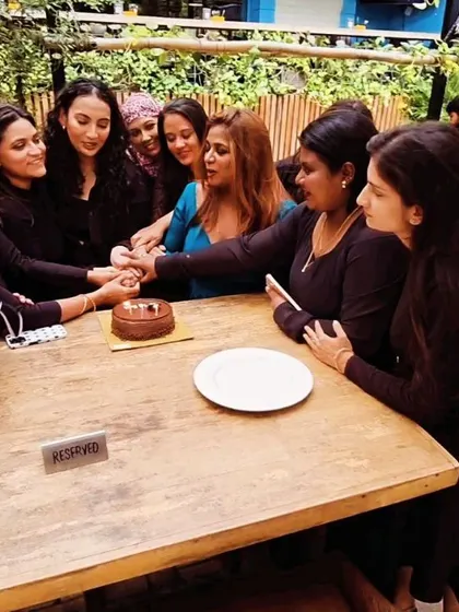 A candid moment of celebration with my students. We work hard in the studio, but we also take time to celebrate our achievements together, like cutting a cake at the end of a batch.