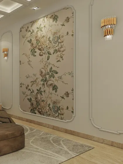 A detail shot of the floral wallpaper with classic wall molding and elegant sconces. This combination brings a timeless charm and a touch of romance to the bedroom.