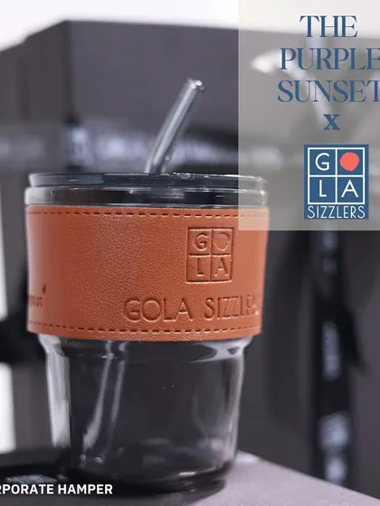 A branded glass tumbler with a leather-style sleeve, created for Gola Sizzlers. This is a great example of a modern and reusable corporate gift.