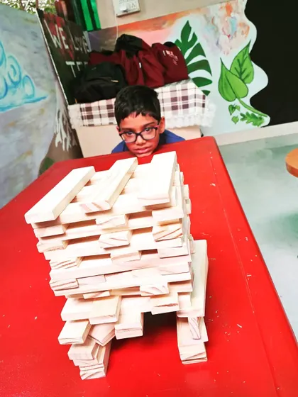 Even with a cast on his arm, this young builder was determined to create. It shows that the desire to build is powerful. He is exploring patterns and balance, proving that everyone can participate and achieve something they are proud of.