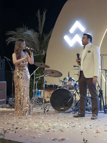 Co-hosting a golden evening for real estate brand WAL Developments. Here, I am engaging with a fellow host on stage, ensuring a dynamic and interactive experience for the audience.
