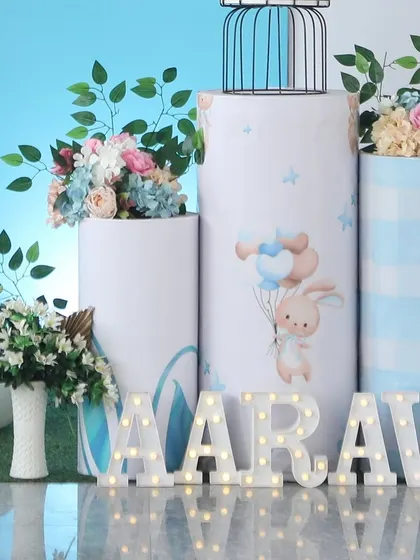 A sweet bunny-themed setup for Aarav's birthday. This shot shows the custom-printed plinths and personalized marquee letters.
