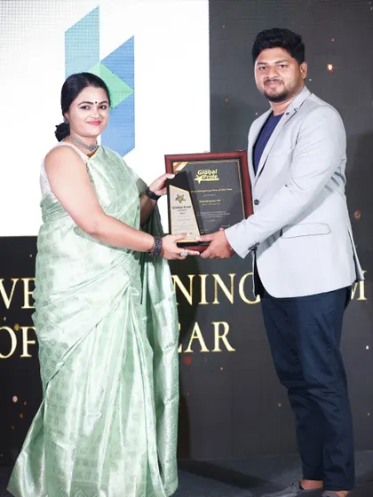 We are honored to be recognized for our work. This moment captures us receiving the "Creative Designing Firm of the Year" award, a testament to our team's dedication to pushing the boundaries of design and construction in Bangalore.