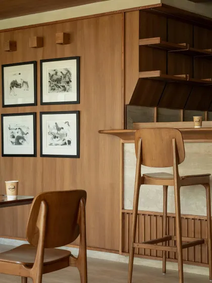 Further images from the BeWell, QBF Coffee, and Tubu projects, illustrating the consistent use of natural materials, clean lines, and thoughtful lighting to create serene and restorative commercial spaces.