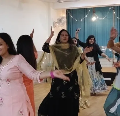 Members enjoying the music and dancing freely during our Diwali party.