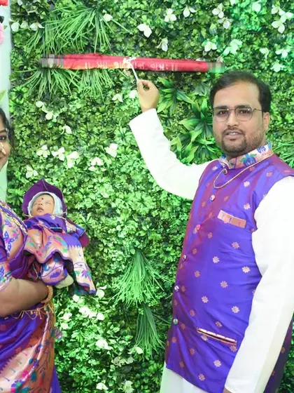 The moment of unveiling the baby's name. A key ritual captured forever.