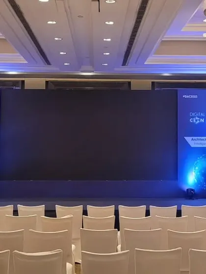 The stage is set for the Digital Architect Conclave before the audience arrives. This highlights our professional staging, dual branding panels, and focused lighting design.