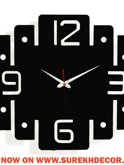 A modern and quirky design, this jazzy wall clock features a square shape with extended arms and rounded corners. The clean, graphic style is perfect for adding a touch of fun and personality to your decor.