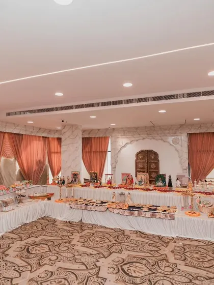 A wide-angle shot of the entire hall for a baby shower, showing how our rukhwat setup becomes a major focal point of the event's decor.