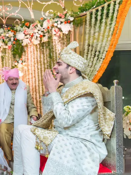 A candid shot of the groom laughing heartily during a pre-wedding ceremony. Capturing these moments of pure, uninhibited joy is what I love most.