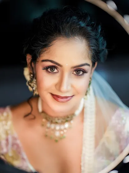 A striking close-up portrait using a ring light to create a beautiful catchlight in the eyes, drawing the viewer in.