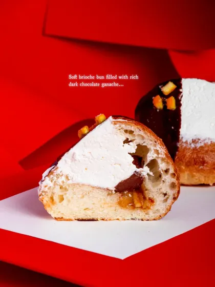 The soft brioche bun is filled with rich dark chocolate ganache.