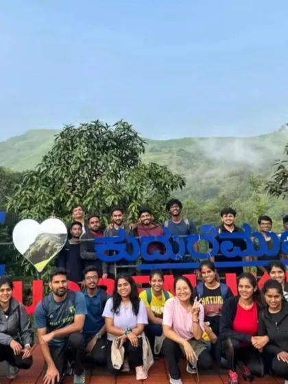 A group photo at the "I Love Kudremukha" sign, a popular spot for trekkers to capture a memory of their visit.