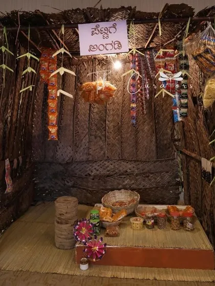 We bring creative concepts to life, like this nostalgic 'Pettige Angadi' or petty shop. It served as a unique photo booth and a conversation starter, filled with old-school snacks and charm for a milestone birthday.