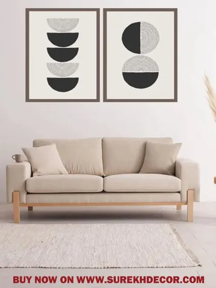 This set of two framed prints features abstract lunar-inspired designs in black and white. The stacked semi-circles create a modern, graphic look that is both simple and visually interesting.