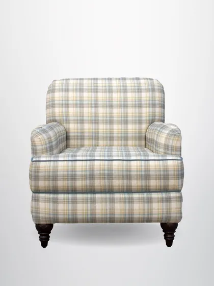 A front view of the plaid armchair, showcasing its classic silhouette and comfortable, deep-seated design.