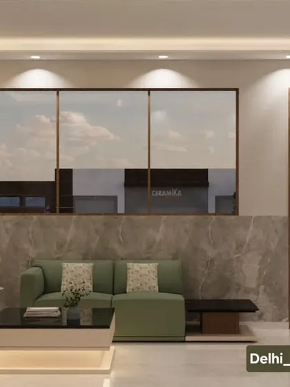 A wider view of the office lounge and entrance. The design ensures a smooth flow from the waiting area to the rest of the office, maintaining a consistent and sophisticated design language.