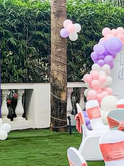 Another angle of the outdoor princess party, showing the coordination between the table settings and the themed backdrops. The pastel colors create a soft and dreamy atmosphere.