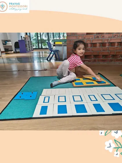 Here, a child is matching shape cards to the insets from the Geometry Cabinet, an extension activity that reinforces shape recognition and classification.