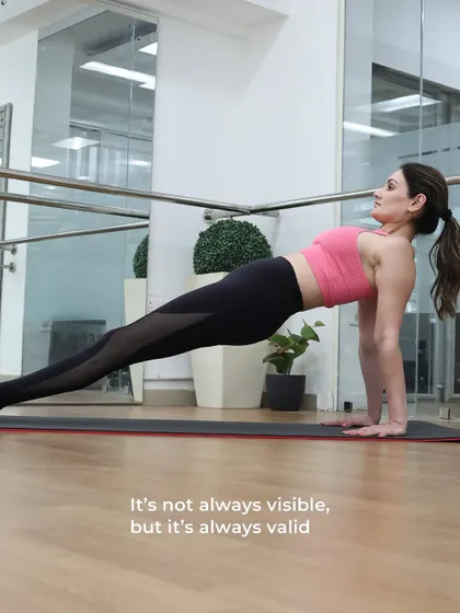 A perfect reverse plank, demonstrating incredible core strength and control. The caption reminds us that progress is about how you feel, not just how you look.