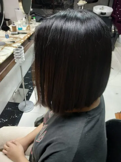 This angle shows how a classic bob sits neatly at the nape of the neck. It's a timeless style that exudes confidence.