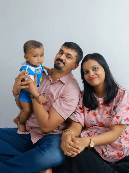 A relaxed, seated family portrait. This pose feels natural and comfortable, allowing the family's personality to shine through.