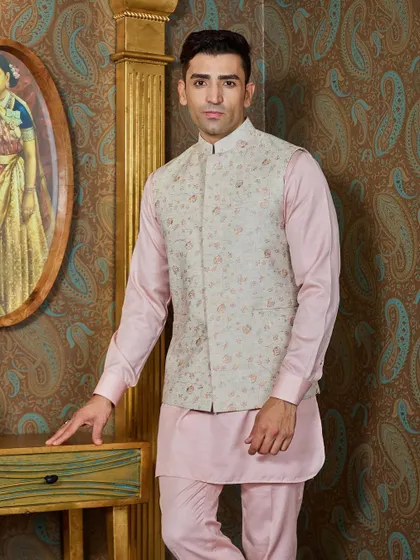 A classic pose showing the full kurta and bundi set. This outfit is a testament to how pastels can be both festive and masculine.