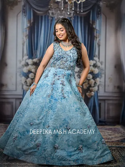 A full-length shot of the model in her princess-like blue gown. The entire look is dreamy and perfect for a fairytale-themed event.
