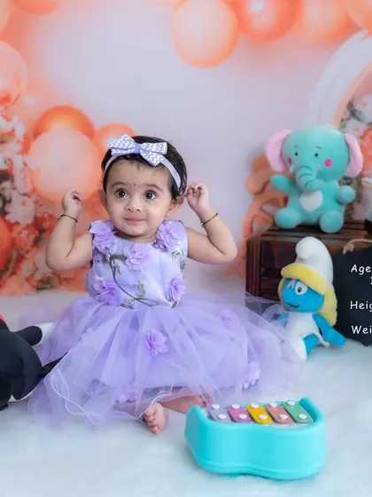 This 9-month-old is sitting up like a pro. Our sitter sessions include fun toys and a milestone board to document your baby's growth and personality.