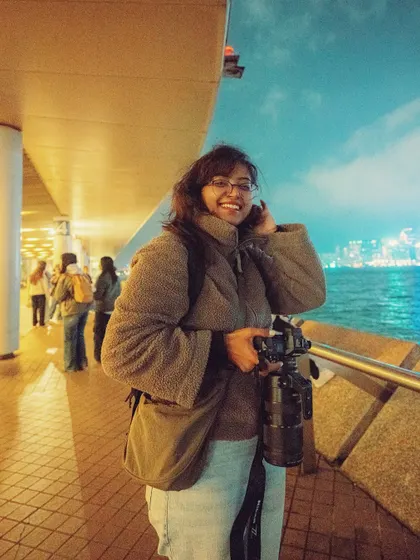A shot from the Hong Kong waterfront at night. This photo shows me with my full camera setup, ready to capture the city's famous skyline after dark.