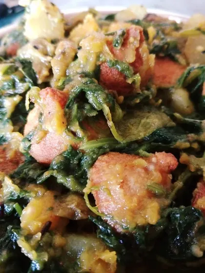 Palong Shakeyr Ghonto, a simple and rustic spinach dish cooked with seasonal vegetables and fried lentil dumplings (bori) for added texture. It's the perfect first course with hot rice.