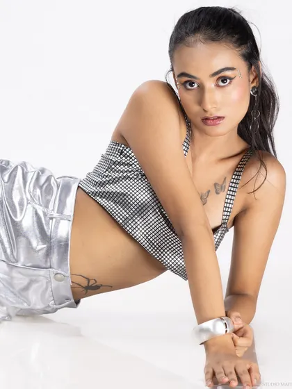 A confident, direct-to-camera pose from the same shoot.