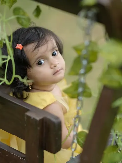 A quiet, thoughtful moment captured on our garden swing. We take the time to capture the calm and innocent expressions too.