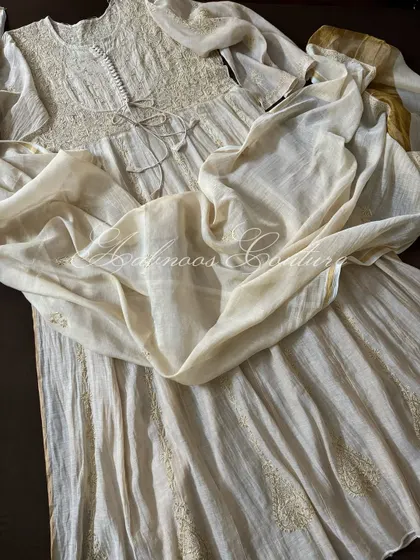 A view of the Anarkali's full flare, showing the subtle sheen of the Tissue Chanderi fabric.
